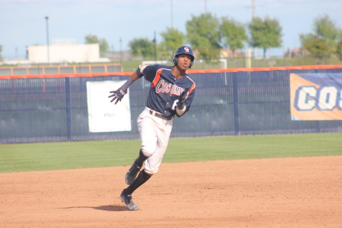 At the bottom of the eighth inning, outfielder Burle Dixon runs to third base. After hitting a triple in mid field for 400 feet on April 12. 