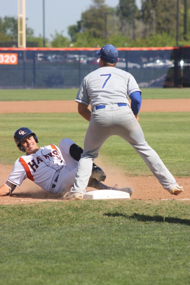 Infielder+Alex+Crouch+slides+to+third+base+after+hitting+a+triple+for+360+ft+into+midfield.+This+play+allowed+utility+Greg+Creamer+and+first+baseman%2Fleft+hand+pitcher+Joey+Pankratz+to+score+on+a+double+RBI%2C+and+the+score+was+5-0+in+the+bottom+of+the+third+inning+on+Tuesday.