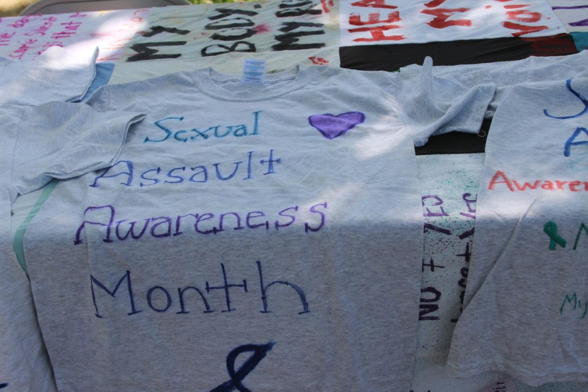 Students were able to write messages on shirts from a table by the quad.