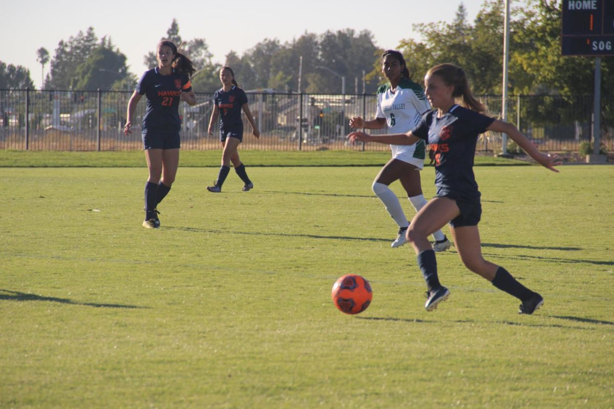 The womens soccer team has high hopes to reach the playoffs this year. Midfielder Taya Bradford, right, is one of 19 freshman on this years team.