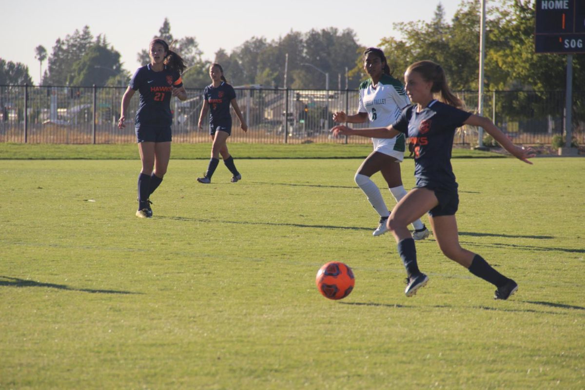 The+womens+soccer+team+has+high+hopes+to+reach+the+playoffs+this+year.+Midfielder+Taya+Bradford%2C+right%2C+is+one+of+19+freshman+on+this+years+team.