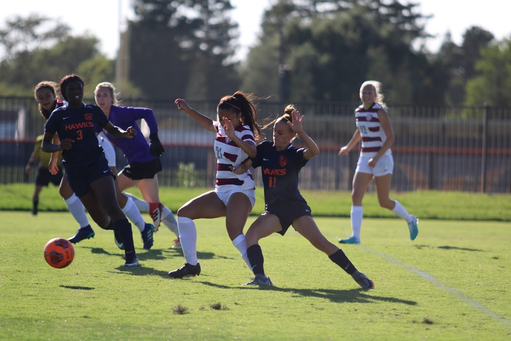Freshman midfielder, Bailey Bradford (right) and fellow teammate Obioma Onejeme work together to keep the ball in CRC's possession. The Hawks lost 2-1 on Sept. 11 to the Wolverines and were on the defensive for most of the game.