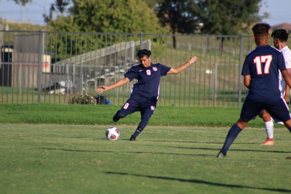 Freshman forward Daniel Ramirez moves the ball upfield in the Hawks 5-0 Victory against the College of Sequoias on Oct. 9. The Hawks have picked up power points in all four of the games in their non conference schedule over the last two weeks. 