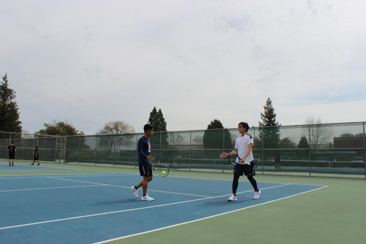 Freshmen Kien Dang (right) and Kyle Lopez (left) celebrate victory in their doubles match on March 19th. Dang and Lopez have been a strong team all year going 3-1 in their matches.