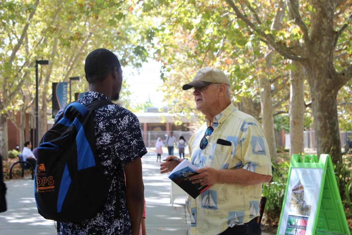 Anti-abortion activists express free speech by talking with students during an unannounced visit to campus on Sept. 10. 