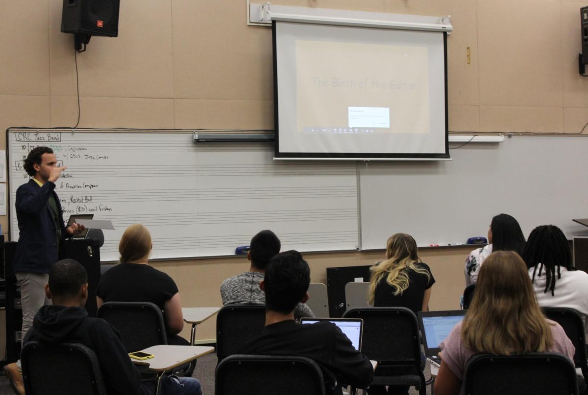 Professor Maxwell Kiesner prepares his Introduction to Music class for presentations on Sept. 18 in Music 306. Kiesner and other music faculty have introduced a new certificate this semester to train music teachers.