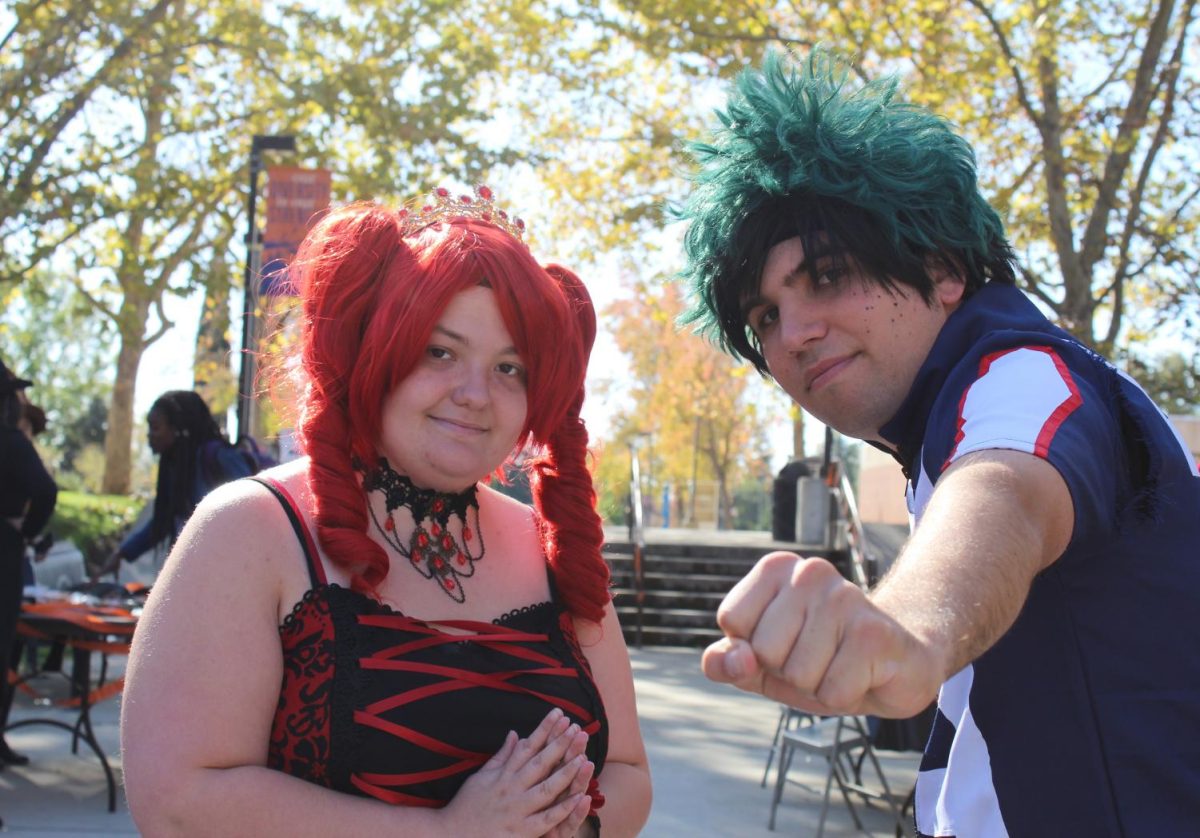 Jessica Hicks (left), a 21-year-old photography major, dressed up as Kasane Teto, a Japanese character similar to Vocaloid Hatsune Miku. Jason Perry (right), a 22-year-old digital media major, dressed up as Midoriya Izuku from Japanese anime My Hero Academia.