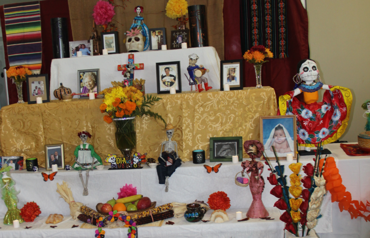 Photographs, candles, food and personal belongings are some of the objects placed on the ofrenda during Dia de Los Muertos. The Puente Club organized their own Dia De Los Muertos Community Celebration on Thursday.