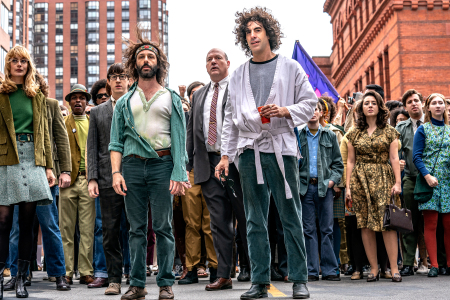 Sacha Baron Cohen and Jeremy Strong as Abbie Hoffman and Jerry Rubin leading protestors through the streets of Chicago. The Trial of the Chicago 7 is now available on Netflix.