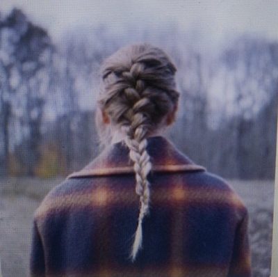 Taylor Swift on her album cover "Evermore." "Evermore" is Swift's ninth studio album and is out now.
