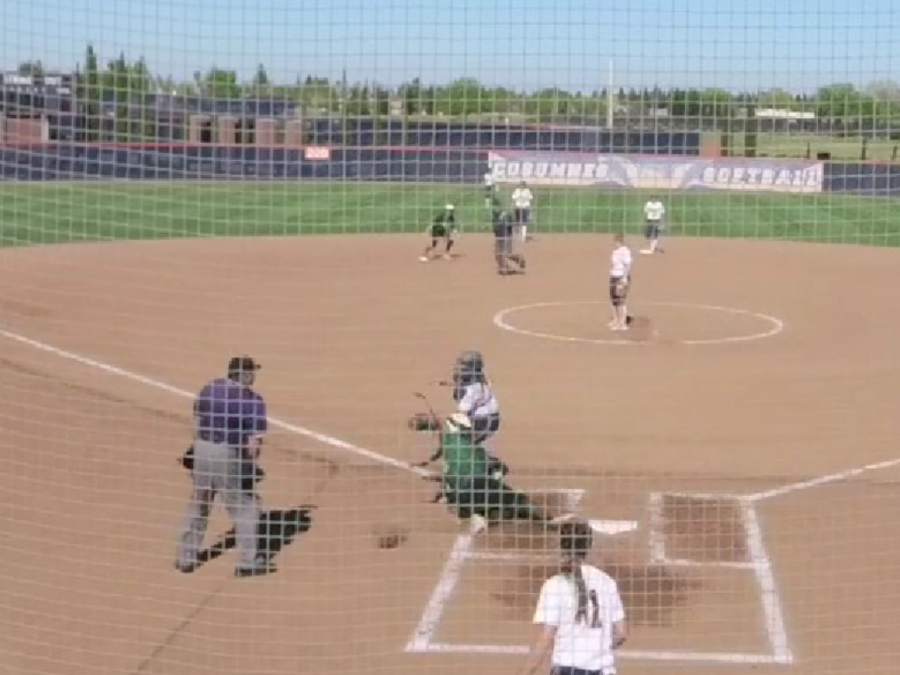 Sophomore catcher Nicole Saravia tagging a runner a home.