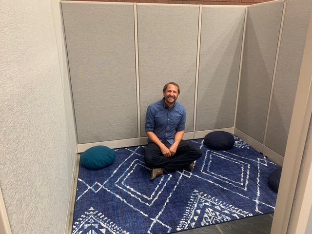 Paul Meinz, a researcher for the Office of Equity, Institutional Effectiveness and Innovation, in the new campus meditation space on Thursday. The space is now located in the library and provides a space for prayer and mindfulness practices.