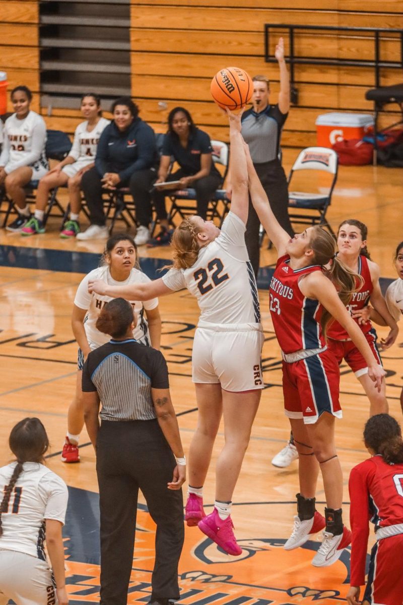 Freshman center Annie Garrison winning the tip-off to start the game against the College of Siskiyous. The game took place at 5 p.m. on Monday at Clark's Court on the CRC campus.