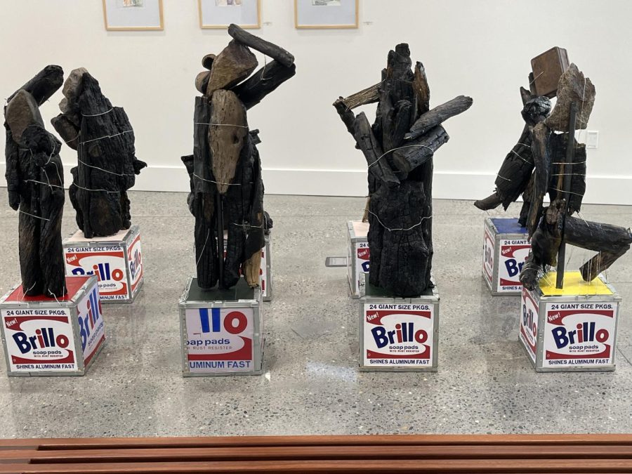 Artist Mel Smothers sculptures at the Wild Gods exhibition on Thursday. The sculptures are his recreation of classical sculptures on top of Brillo boxes.