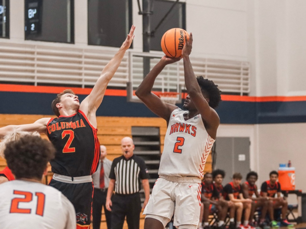 The mens basketball team loses to the Columbia Lions 87-80 on Saturday. Sophomore guard Brandon Scott shoots a basket over the defender. 