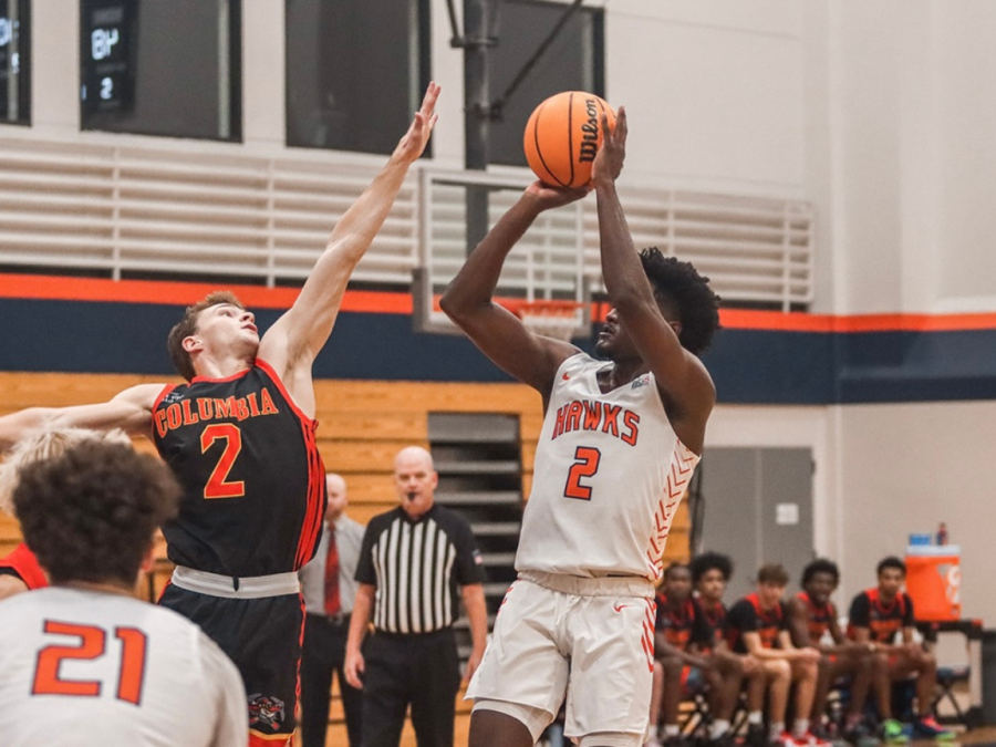 The men's basketball team loses to the Columbia Lions 87-80 on Saturday. Sophomore guard Brandon Scott shoots a basket over the defender. 