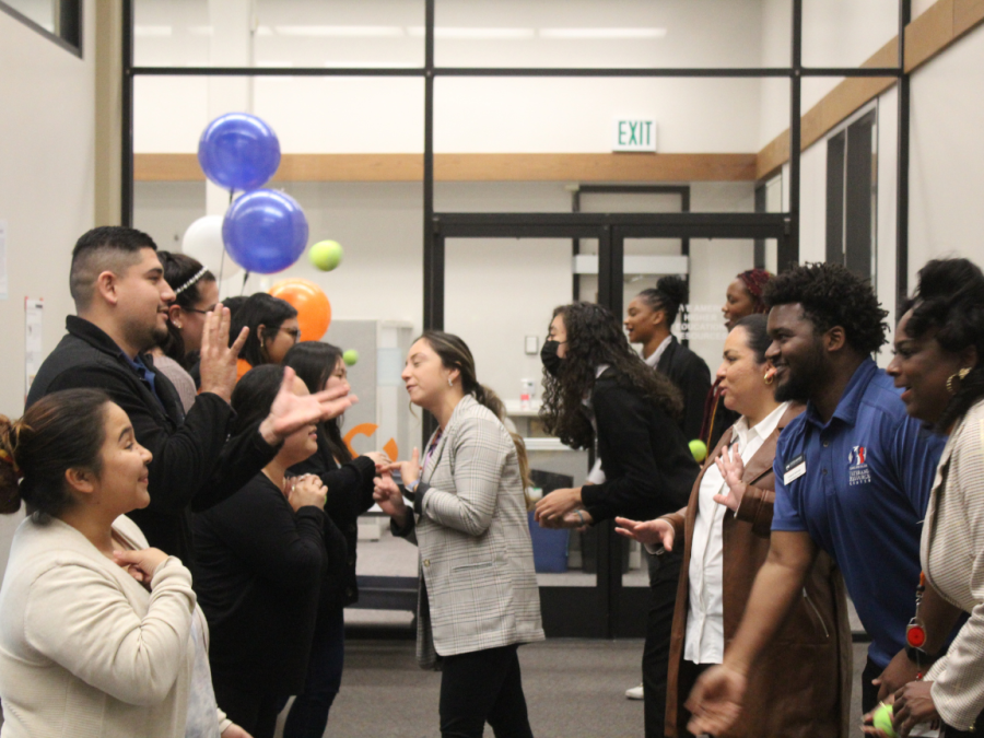 CRC+celebrated+Hmong+New+Year+in+the+library+on+Wednesday.+Attendees+of+the+event+playing+a+traditional+Hmong+game+called+Pov+Pob.