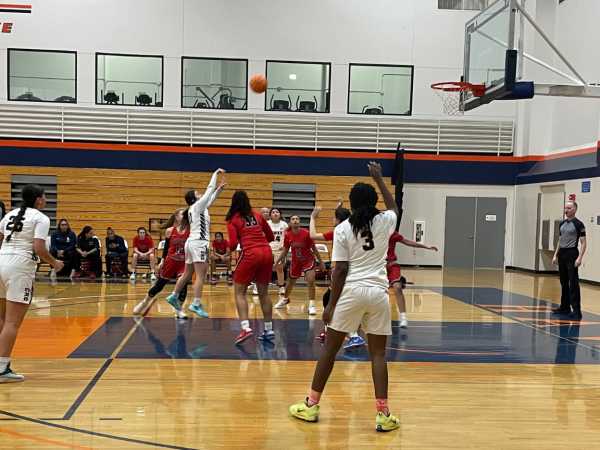 Freshman guard Luisa Contreras shooting a field goal while surrounded by defenders. This happened during the Friday game loss against American River College.