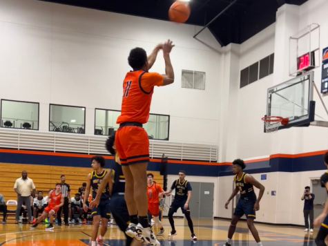 Sophomore wing James Gill shooting a 3-pointer in the first game of the California Community College Athletic Association playoffs on Thursday. The Hawks would go on to win the game with a final score of 84-71.