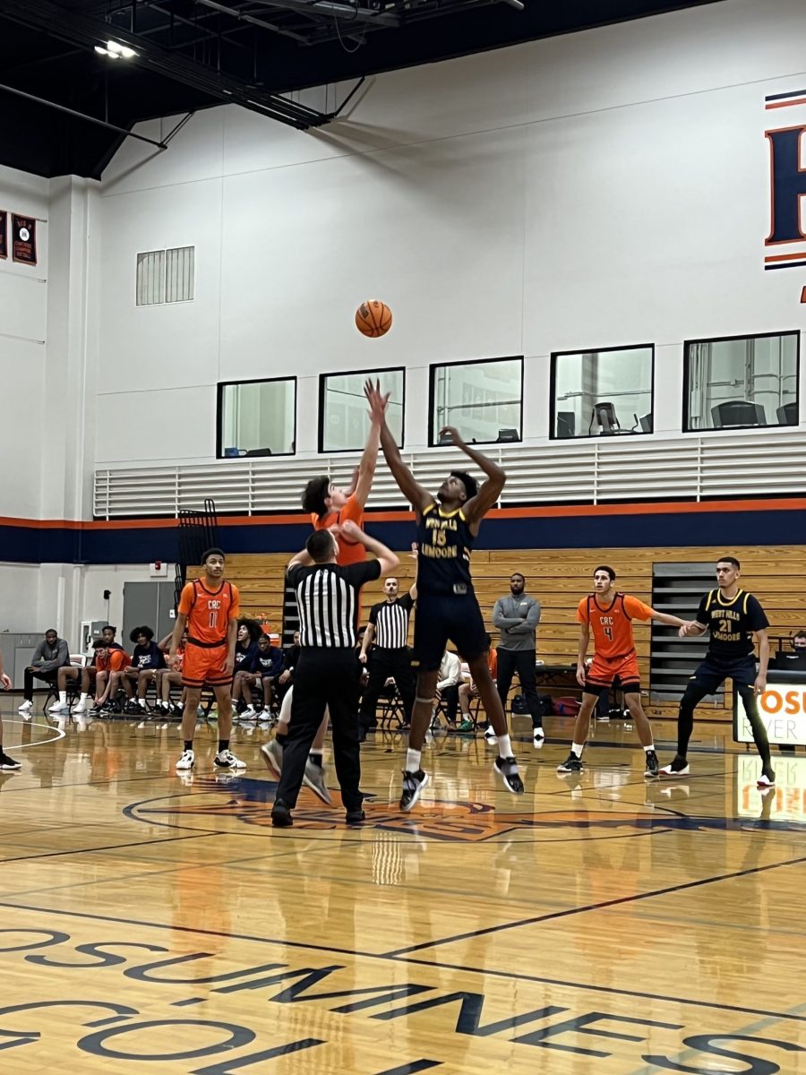Tip-off for the men's basketball team's last win of the season on Feb. 22 against the West Hills College Lemoore. Freshman wing Antonio Tercero (middle), sophomore guard Kyree Dunn (left) and sophomore wing Kaleb Drake (right) on the floor to start the game for the Hawks.
