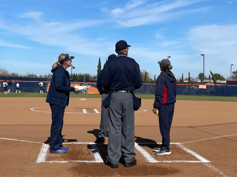 Hawks head coach Kristy Schroeder on the left and Beavers head coach Lisa Delgado on the right exchanging lineup cards to the umpires. The Hawks swept the Beavers in the doubleheader on Thursday.
