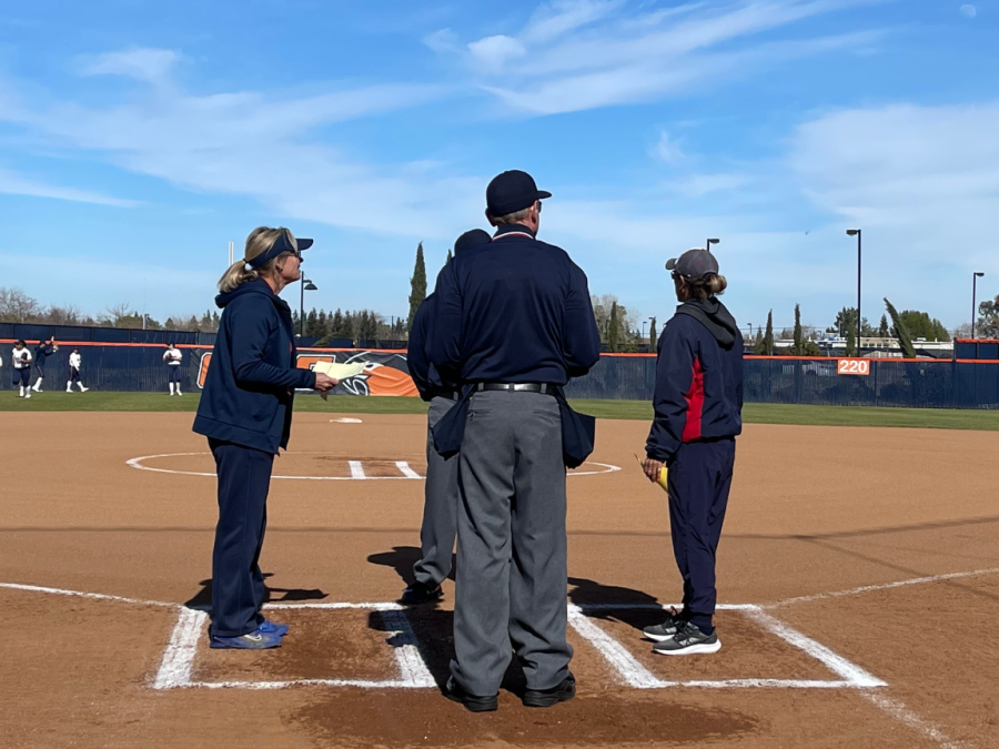 Hawks+head+coach+Kristy+Schroeder+on+the+left+and+Beavers+head+coach+Lisa+Delgado+on+the+right+exchanging+lineup+cards+to+the+umpires.+The+Hawks+swept+the+Beavers+in+the+doubleheader+on+Thursday.