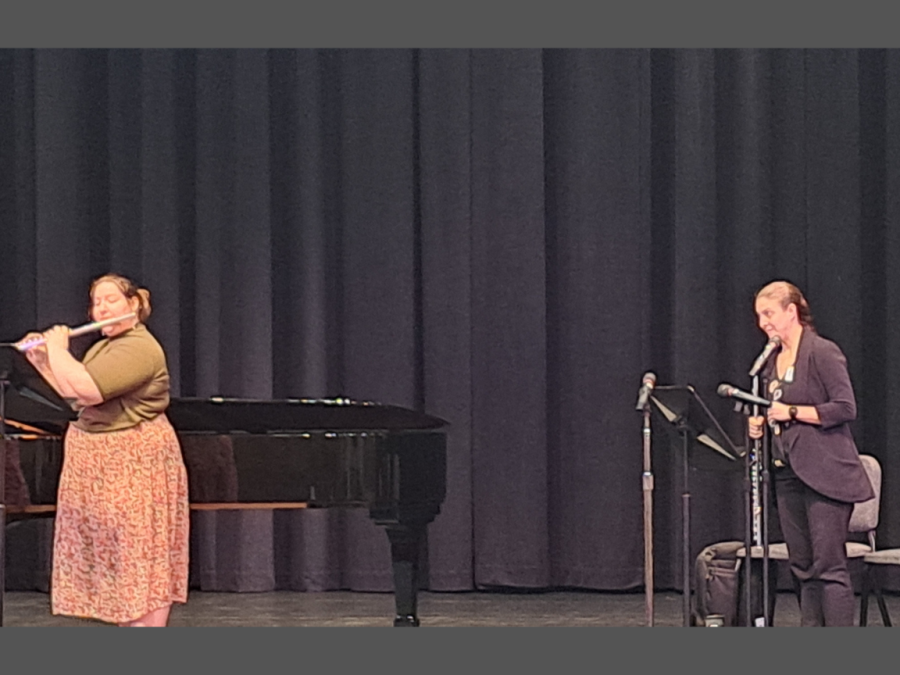 Assistant Professor of Flute at University of Northern Iowa Hannah Porter Occeña on the right listening to 19-year-old music therapy major at the University of the Pacific Grace Coon play the flute on the left. Occeña gave tips to all the musicians after they performed.