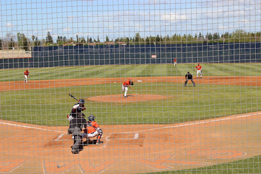 Freshman pitcher Mike Freitas pitching in the first game of the series against American River College. The Hawks won the game with a final score of 12-5.