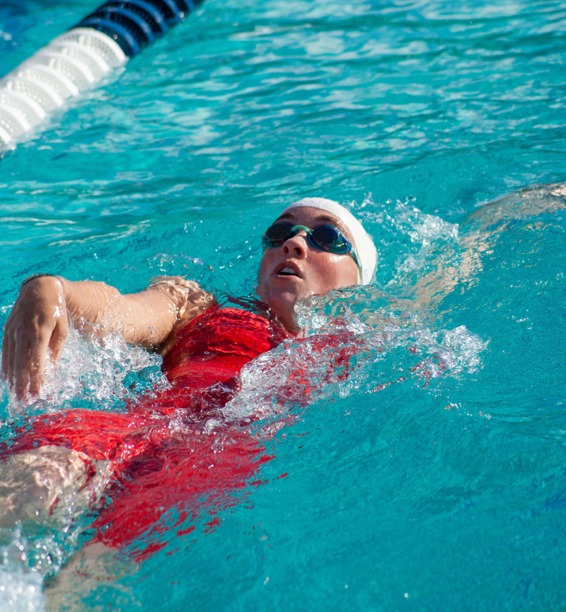 Sophomore butterfly swimmer Madison Ledbetter doing backstrokes. The women's swim team season ended after the Big 8 championship on April 22.