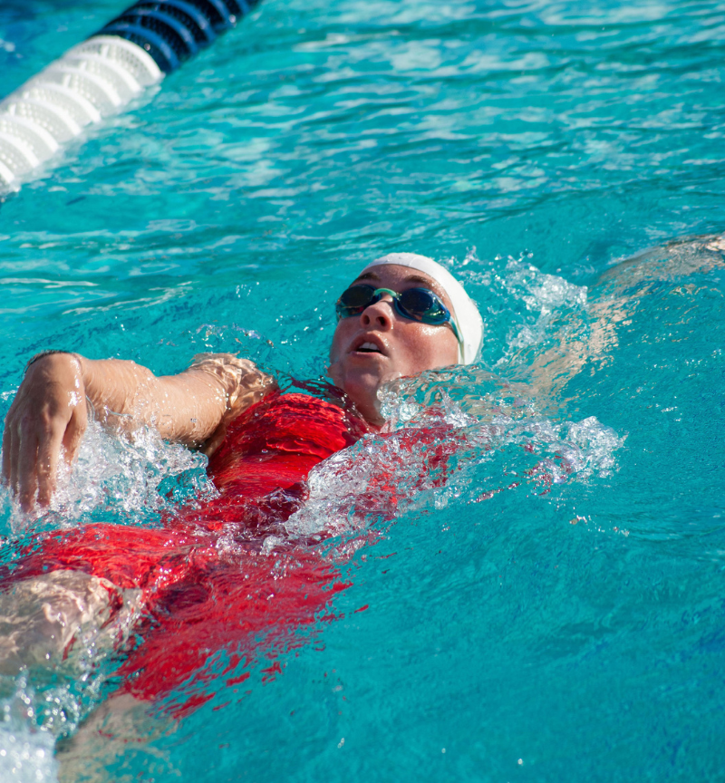 Sophomore butterfly swimmer Madison Ledbetter doing backstrokes. The womens swim team season ended after the Big 8 championship on April 22.