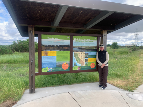 Stone Lakes Park Ranger Amy Hopperstad standing next to an interpretative kiosk. Stone Lakes National Wildlife Refuge is located at 1624 Hood Franklin Road. 
