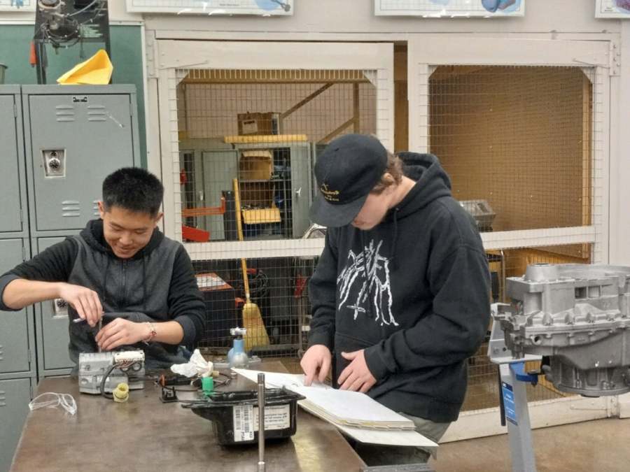 Two automotive technology students working on a project in Automotive Professor Michael Pereira's class. Pereira is one of the professors involved in the Ford ASSET program.