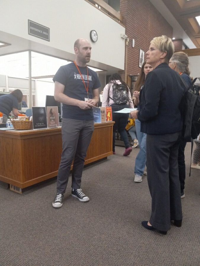 The Human Library Organization visited the campus on May 3 in the library to share stories with students. Organizers of the event discussing the check out schedule for the books.