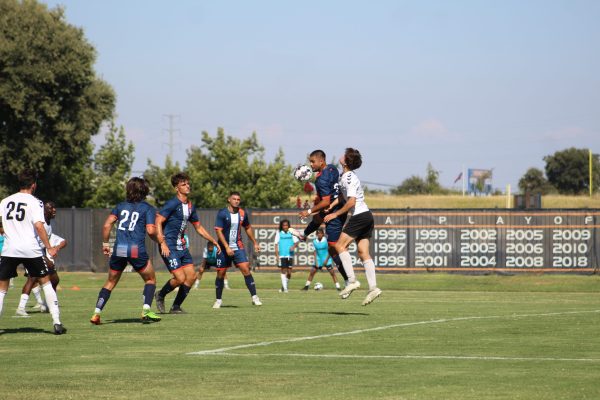 Sophomore center back and captain Marco Valdez making a play with his head against the Sac Republic 18U Team on Aug. 25. Their next home game is on Sept. 8 against Monterey Peninsula College.