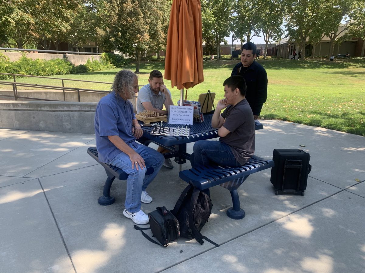Dr. Edwin Fagin, economics professor and the chess club's advisor, meets with members on Thursday at 12:30 in the quad. Over a dozen people attended the club's first in-person meeting since COVID-19.