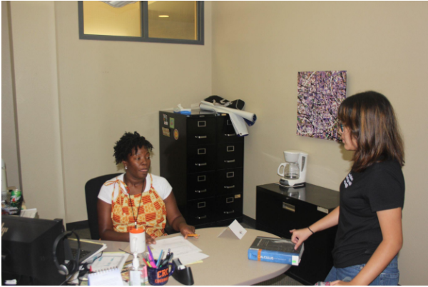 Tutoring Service Coordinator Ryana Fisher speaks to a student in her office inside the Tutoring Center. The Tutoring Center, located on the second floor of the Learning Resource Center, is having an Open House on Sept. 13 and 14 from 8:30 a.m. to 4:30 p.m.
