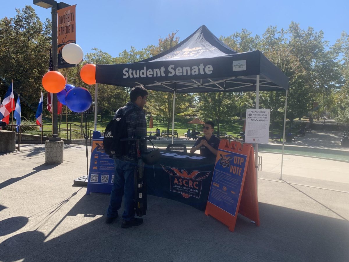 Student Senate Treasurer Holden Alameda advises a student to vote in favor of Measure A in the upcoming Oct. 10 and Oct. 11 special election. The results will affect how all Los Rios students afford public transportation.