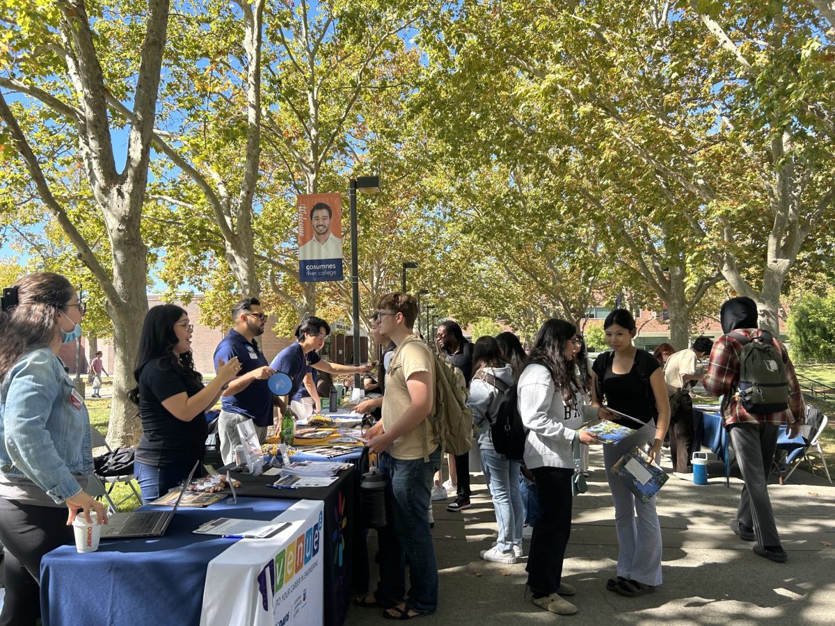 Students learn information about different colleges during Transfer Day on Oct. 5 in the quad. More than 50 colleges were in attendance with university representatives talking to students about their majors and programs.