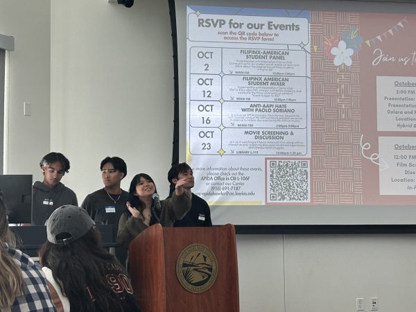 Kasamahan Pilipino Club President Alyanna Manzano (front) showcases events for Octobers FilipinX History Month. The club hosted an event with traditional food and karaoke on Oct. 12.