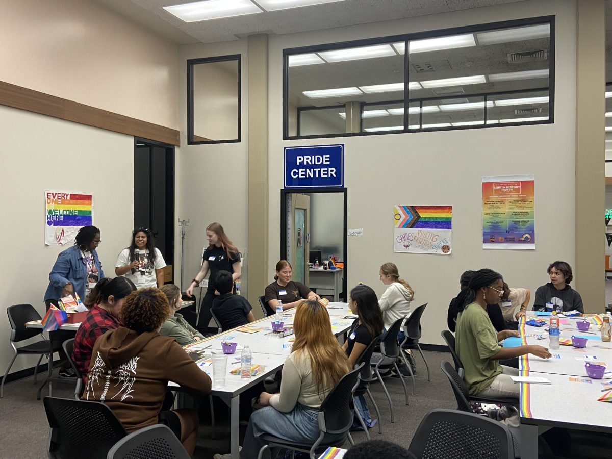 The+Pride+Center%E2%80%99s+Student+Personal+Assistant+Alejandra+Trejo+and+Clerk+Yvonne+Johnson+hosts+bingo+and+trivia+at+their+mixer+supporting+community+growth+on+Wednesday.+The+Pride+Center+is+open+Monday+through+Friday+to+all+students+and+staff.