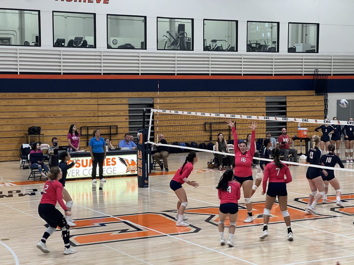 The+women%E2%80%99s+volleyball+team+plays+against+American+River+College+on+Oct.+4+in+a+close+match+that+ended+in+a+1-3+loss.+The+team+wore+pink+jerseys+in+honor+of+Breast+Cancer+Awareness+Month.