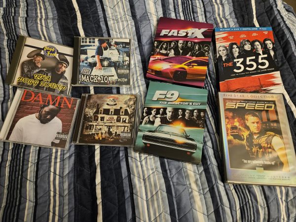 Staff writer Emanuel Espinoza displays a portion of his personal collection showing physical media isnt dead and can be preferred over digital versions. Some of these items were recently bought online and are hardly found in stores.
