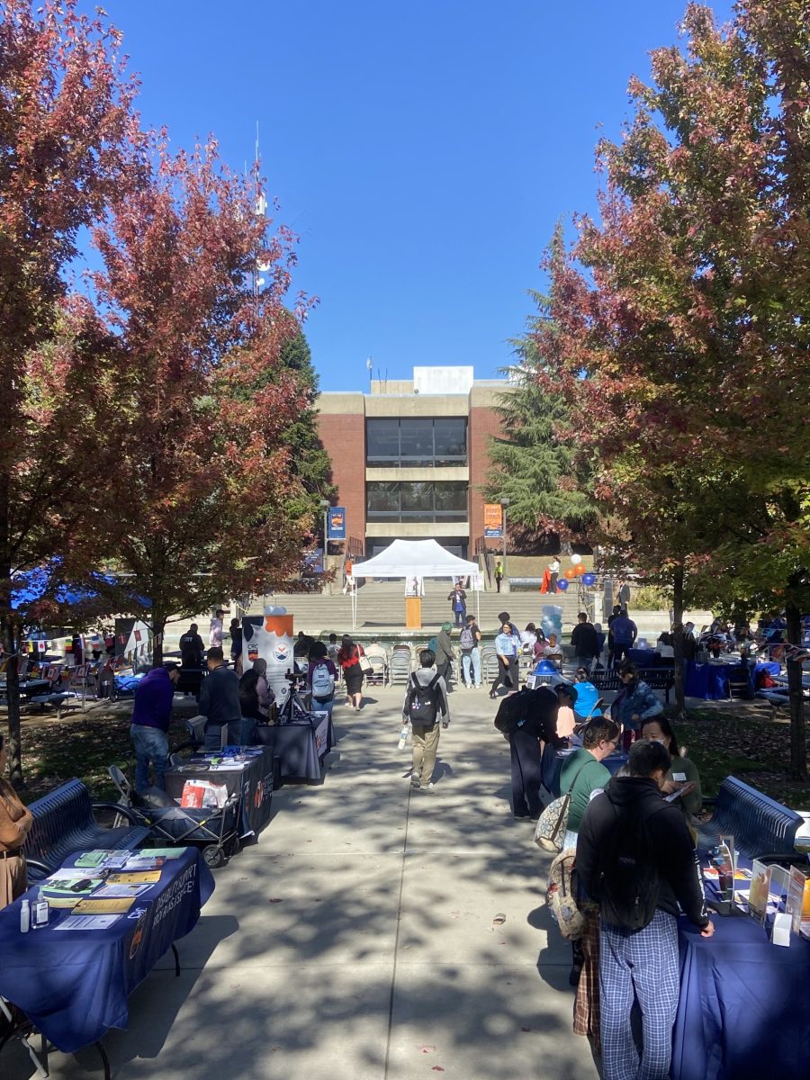 Students+gather+for+National+First-Generation+College+Day+on+Wednesday+in+the+quad.+The+event+featured+campus+resource+tables+for+students%2C+food%2C+speakers+and+raffle+prizes.