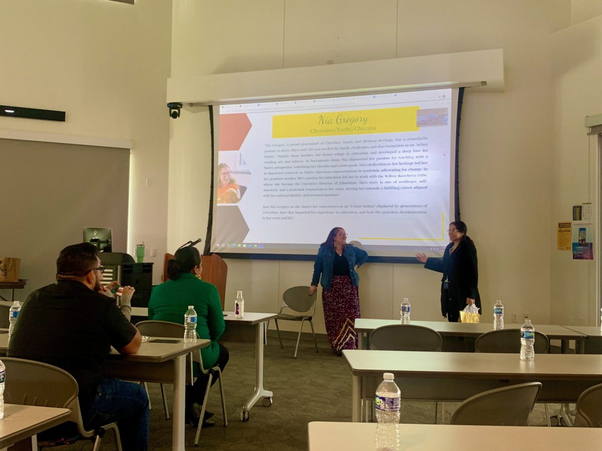 Native Heritage Week committee member Dr. Crystal Martinez-Alire presents speaker Nia Gregory with a gift on Monday. Gregory spoke on education as one of six keynote speakers planned for CRCs American Indian and Alaska Native Heritage Month.