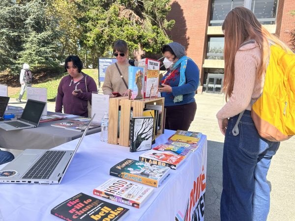Local queer-owned bookstore, A Seat at the Table, collaborates with Cosumnes River College’s Radical Library for their book drive on Wednesday. The Radical Library is located in the Center for Inclusion and Belonging and features books that have been banned or challenged.