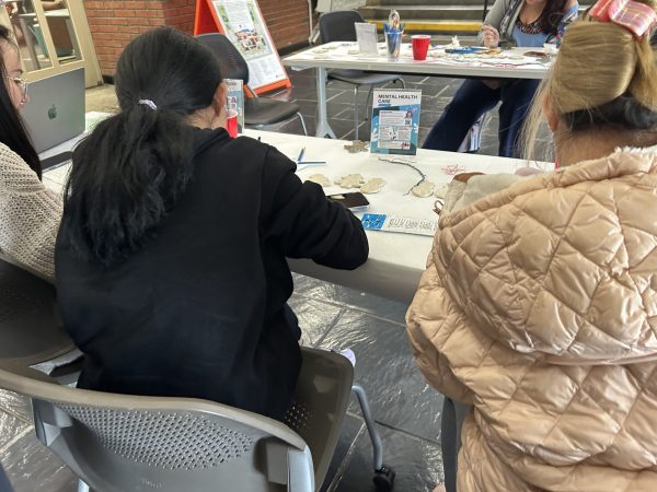 Students in the library outside of the Center for Inclusion and Belonging (CIB) decorating holiday ornaments for a de-stress event. The event included a workshop with Social Wellness Practitioner Marianna Sousa, who has worked with Cosumnes River College for 10 years.