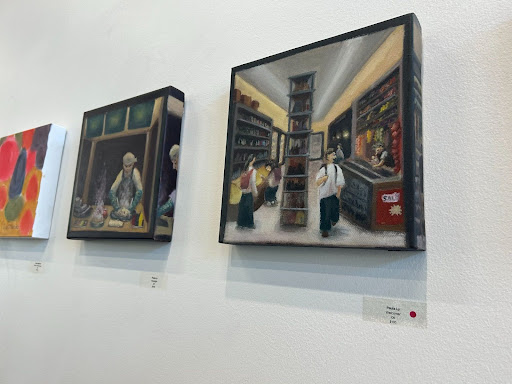 Paula Ly, a 21-year-old art major, sold her oil painting titled “Welcome” (right) during the opening event on Nov. 30. A hundred "10X10" pieces were submitted into the Art Gallery by students and staff.