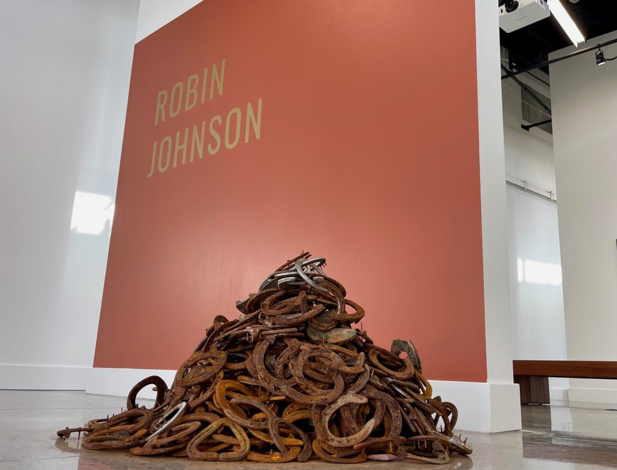Golden Hills, by Cosumnes River College Art Department Chair and Professor Robin Johnson is displayed near the front doors of the Art Gallery. Johnson said, Golden Hills is made up of 500 used horseshoes, representing the expectation of life truly being built on hard work and labor. 
