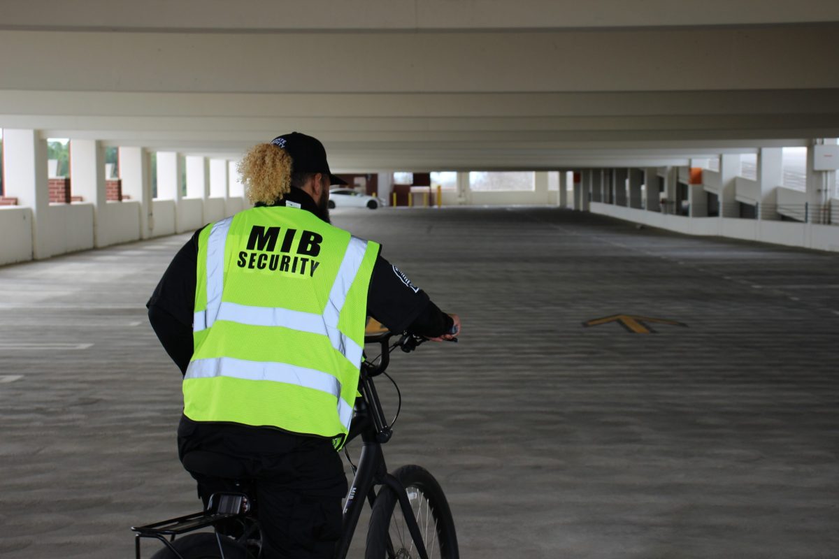 Members in Black can be identified by their bright green vest with the MIB logo throughout campus. They were hired by campus to be additional security as the campus deals with an increase of rowdy local high school students and homeless individuals causing disturbances. 
