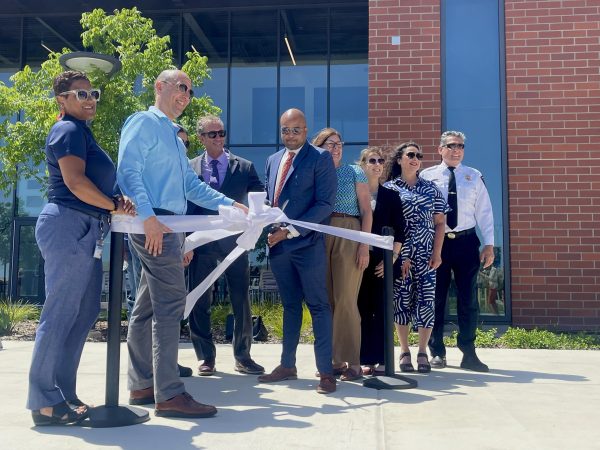 Cosumnes River College President Dr. Edward Bush cuts the ribbon outside of Building B at the Elk Grove Center on Wednesday. The new facility is a $20 million facility housing classrooms and laboratories for biology, chemistry and other science courses.